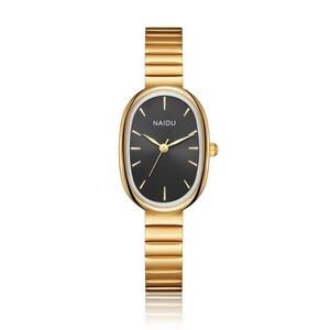Close-up of small oval quartz watch with gold metal strap and deep matte black dial