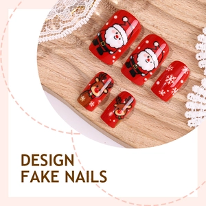 Christmas press-on nails with red base featuring Santa Claus and reindeer designs