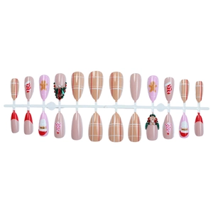 Almond Christmas press-on nails set with Santa, gingerbread man and green gemstone designs