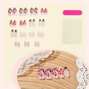 Handmade 3D floral almond press-on nails set with red flowers and polka dot patterns