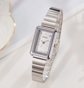 Detailed side view of a rectangular silver quartz watch with a metal link bracelet