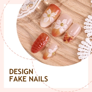 3D embossed almond press-on nails with amber gradient and white floral design