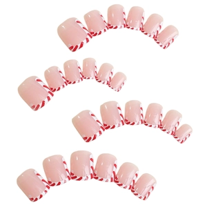 Short Christmas press-on nails with nude base and red-white striped candy cane french tips