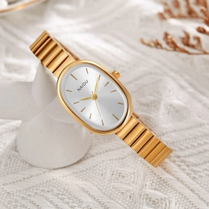 Elegant gold quartz watch with oval dial and metal link bracelet on white knit background
