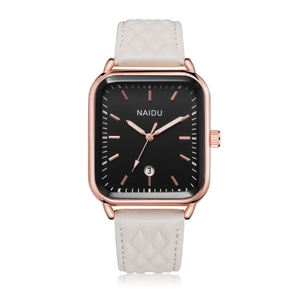 Detail of rectangular rose gold quartz watch with white quilted leather strap and black dial
