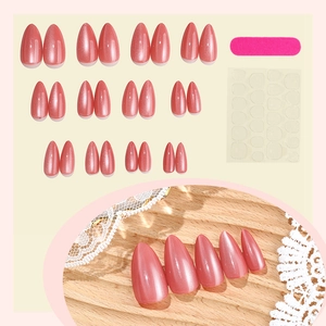 Pink cat-eye almond press-on nails set with 24 pieces, mini file, and adhesive tabs