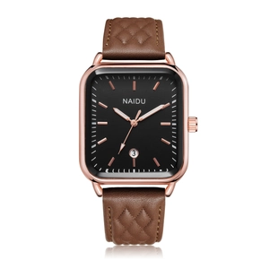 Detailed macro view of rectangular rose gold watch with black dial and date window