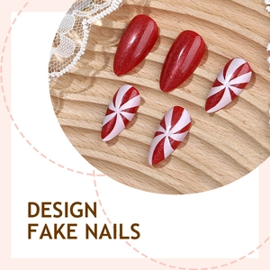 Christmas red cat-eye and peppermint stripe press-on nails in almond shape