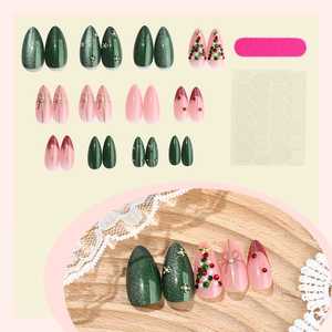 Christmas press-on nails set with 3D tree bow and rhinestones on green almond nails