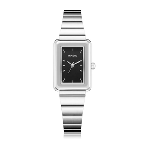 Macro shot of rectangular silver quartz watch with brushed metal finish and black dial