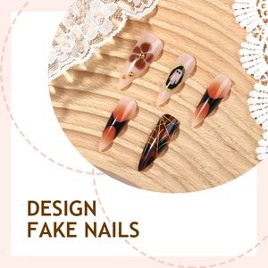 Halloween stiletto press-on nails with warm brown gradient and golden ghost spider web art
