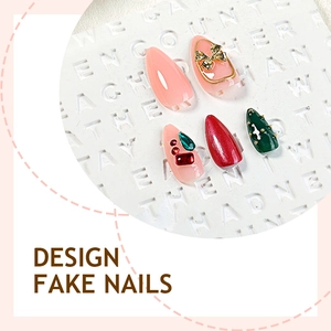 Luxurious Christmas press-on nails set with 3D gold bows and colorful rhinestones