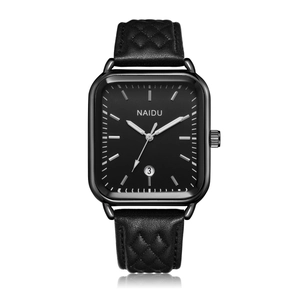 Detailed macro view of the rectangular black quartz watch with date window and quilted leather strap