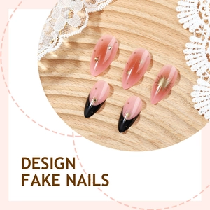 Luxurious long almond press-on nails with pink gradient, black French tips and gold stars