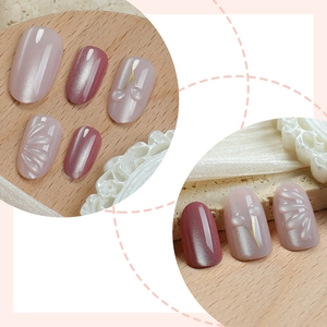 3D cat-eye press-on nails with nude pink gradient, cherry charms, and floral relief
