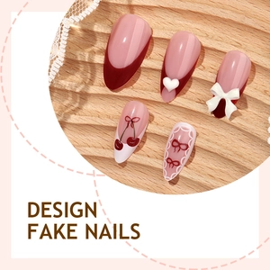 French press-on nails with cherry, white bow and heart designs on natural pink base
