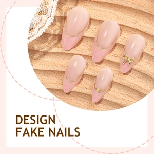 Short almond press-on nails with pink gradient, gold lines and 3D bow accent