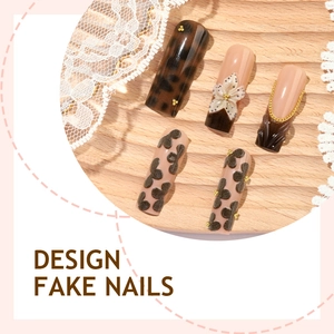 French leopard print press-on nails with 3D floral accents and golden chains