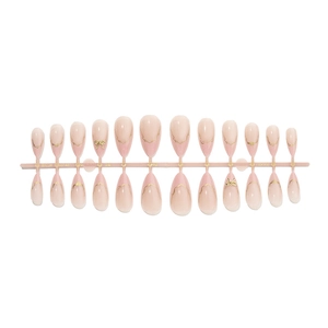 Short almond press-on nails set with elegant nude pink base and gold bow 3D accents