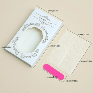 Detail of white nail packaging box with dimensions, pink nail file and adhesive tabs