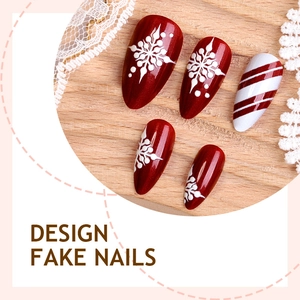 Christmas almond false nails with red snowflake design and candy cane pattern