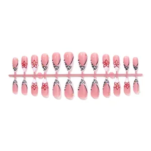 Almond press-on nails with leopard print, French tips, and 3D floral accents in pink and red