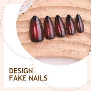 Vintage red gradient French press-on nails with cross accents and cat-eye finish