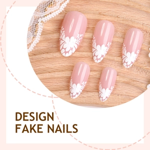 French style almond nails with 3D white flowers on soft pink base displayed on wood