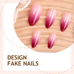 Almond-shaped gradient purple-pink press-on nails with glitter tips on wooden board
