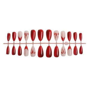 Faux ongles amande rouges œil de chat style french avec nœuds et cristaux