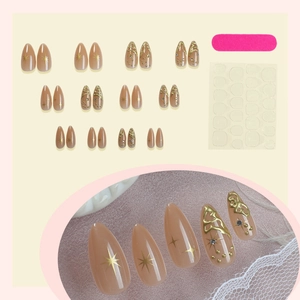 Almond press-on nails with golden star patterns and rhinestones, 24 pieces set with tools