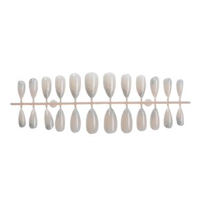 Elegant almond-shaped press-on nails with nude base and silver glitter french lines