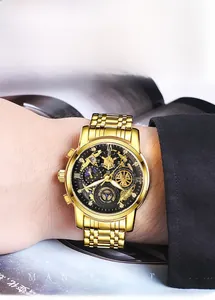 Golden business watch for men featuring a multifunctional dial on a male wrist