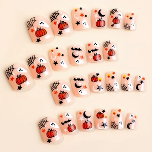Flat lay of 24pcs Halloween press-on nails featuring pumpkin, ghost and bat patterns