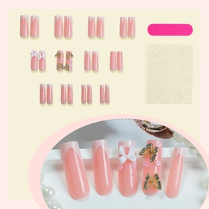 Long French white tip press-on nails with 3D bows and rhinestones on nude pink base