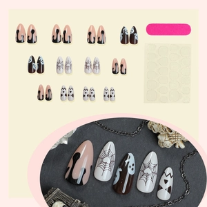 Halloween almond fake nails set with ghost and spider web designs including tools