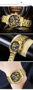 Detail view of a luxury men's gold hollow watch with multi-functional black and gold dial