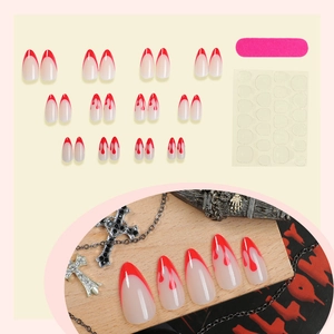 Halloween almond press-on nails with red French tips and blood drip patterns with tools