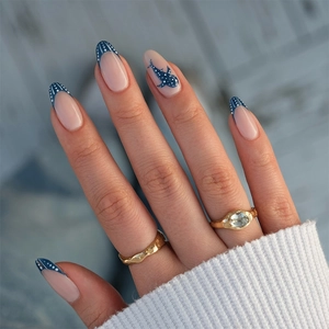 Blue ocean theme almond press-on nails with cartoon shark design and French polka dot tips