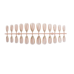 Cat eye almond press-on nails with shimmering gold wire lines and nude pink finish