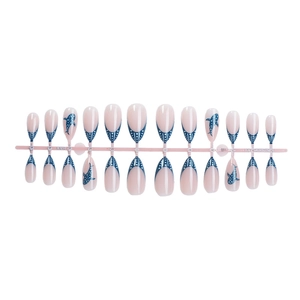 Blue ocean almond fake nails with cartoon shark silhouettes and white polka dot accents