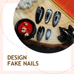 Halloween press-on nails featuring black spider web and bat designs on round wooden tray