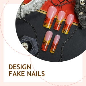 Faux ongles Halloween avec dégradé orange et motifs de citrouilles forme cercueil