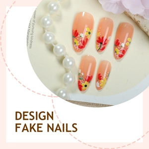 Almond shaped press-on nails with peach base and elegant hand-painted autumn floral designs