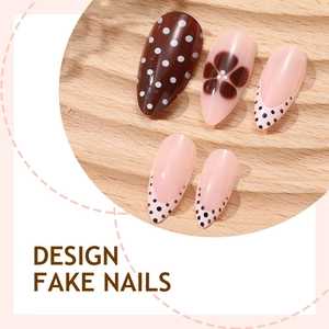 Handmade brown and pink press-on nails with polka dots and floral designs