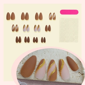 French almond press-on nails set with glitter gold lines in matte brown and nude pink