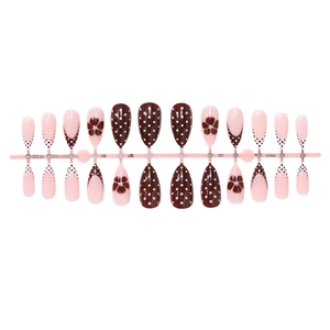 Brown and pink almond press-on nails with polka dots and floral french tip design