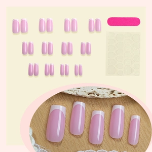 24-piece pink French press-on nail kit with white tips, file and adhesive tabs set