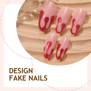 Halloween almond press-on nails with red blood drip design on translucent pink base