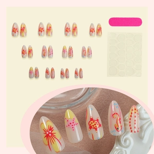 Almond-shaped false nails with ocean turtle and seahorse patterns on ivory base
